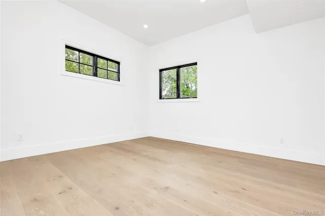 a view of an empty room with windows