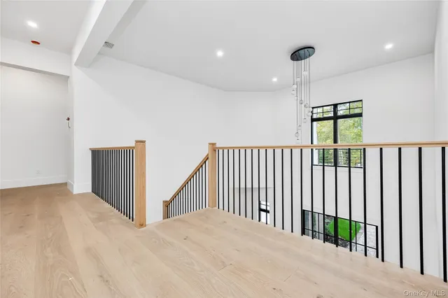 a view of an entryway with wooden floor