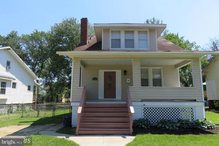 3819 Barrington Road Baltimore, MD 21215 - Photo 1 of 19 a front view of a house with garden