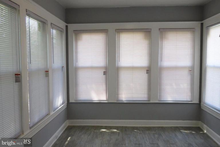 3819 Barrington Road Baltimore, MD 21215 - Photo 14 of 19 a view of an empty room with a window