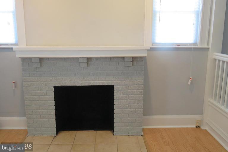 3819 Barrington Road Baltimore, MD 21215 - Photo 3 of 19 a living room with a fireplace