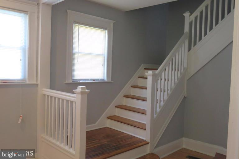 3819 Barrington Road Baltimore, MD 21215 - Photo 4 of 19 a view of entryway and hall with wooden floor