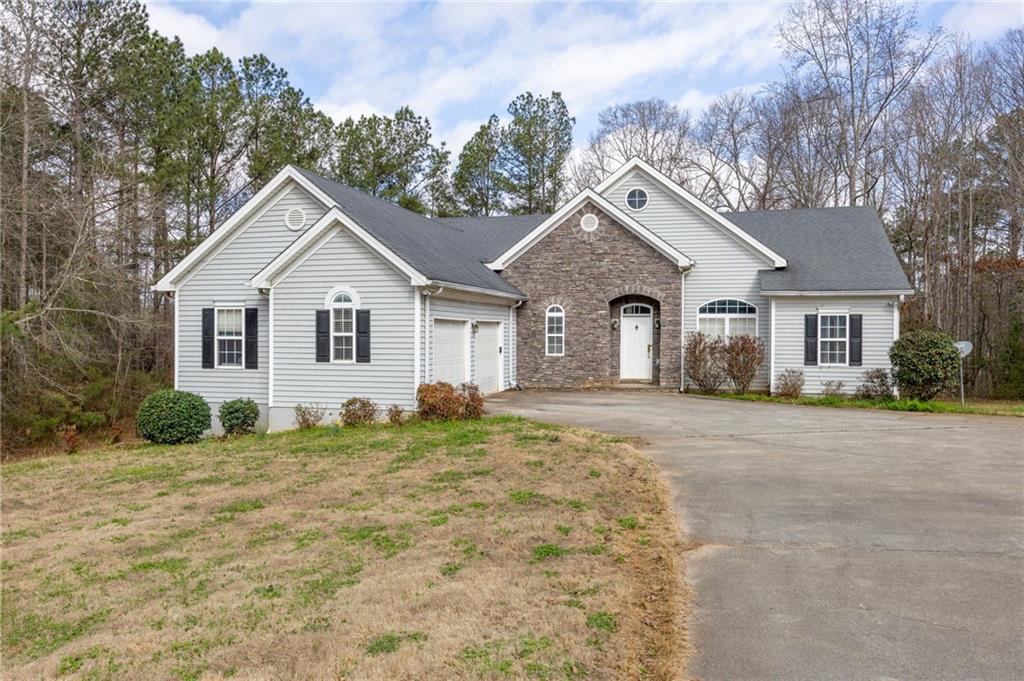 7387 Milam Road Winston, GA 30187 - Photo 5 of 41 a view of a house with a yard and large tree