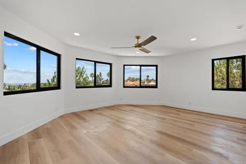 a view of an empty room with windows