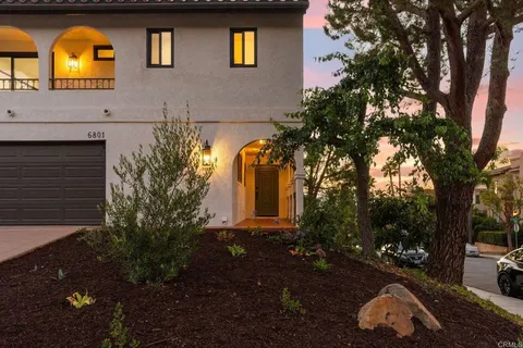 a front view of house with yard space and swimming pool