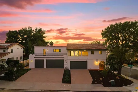 a front view of a house with yard