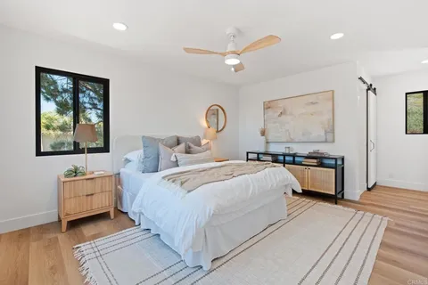 a bedroom with bed and a window