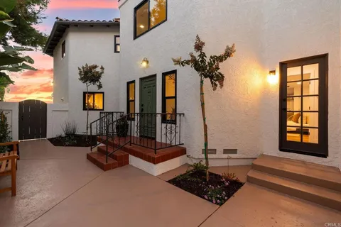 a front view of a house with parking