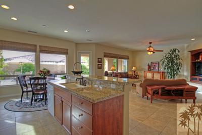 81129 Soaring Hawk Court Indio, CA 92201 - Photo 15 of 25 a view of a dining room with furniture window and outside view