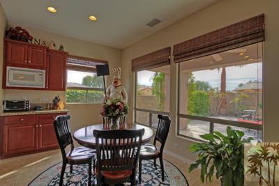 81129 Soaring Hawk Court Indio, CA 92201 - Photo 16 of 25 a view of a dining room with furniture window and outside view