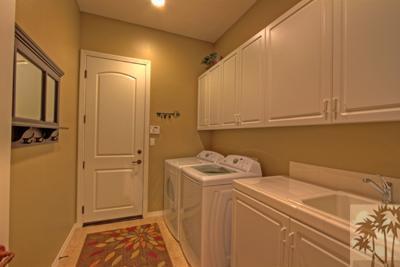 81129 Soaring Hawk Court Indio, CA 92201 - Photo 24 of 25 a utility room with dryer and washer