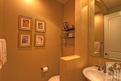 81129 Soaring Hawk Court Indio, CA 92201 - Photo 25 of 25 a bathroom with a sink mirror and toilet