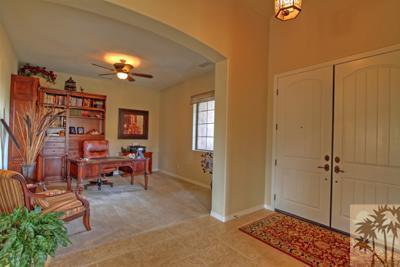 81129 Soaring Hawk Court Indio, CA 92201 - Photo 7 of 25 a view of a livingroom with workspace and a window