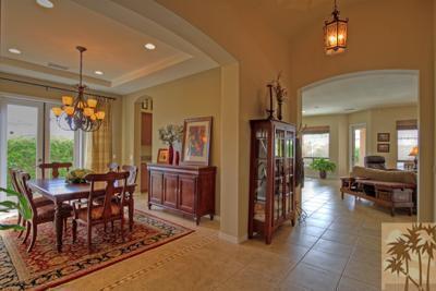 81129 Soaring Hawk Court Indio, CA 92201 - Photo 9 of 25 a view of a dining room with furniture window and wooden floor