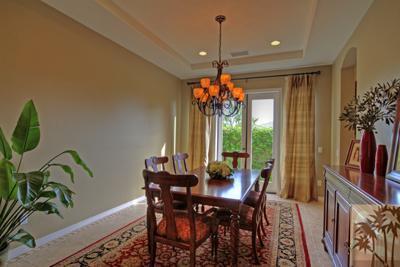 81129 Soaring Hawk Court Indio, CA 92201 - Photo 10 of 25 a view of a dining room with furniture window and outside view