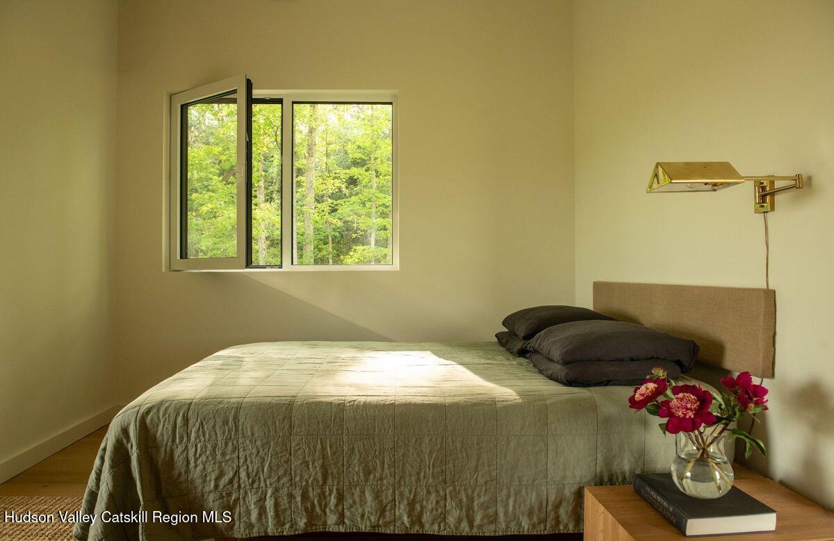 346 Cold Spring Road Hudson, NY 12534 - Photo 12 of 25 a bedroom with a bed and a window