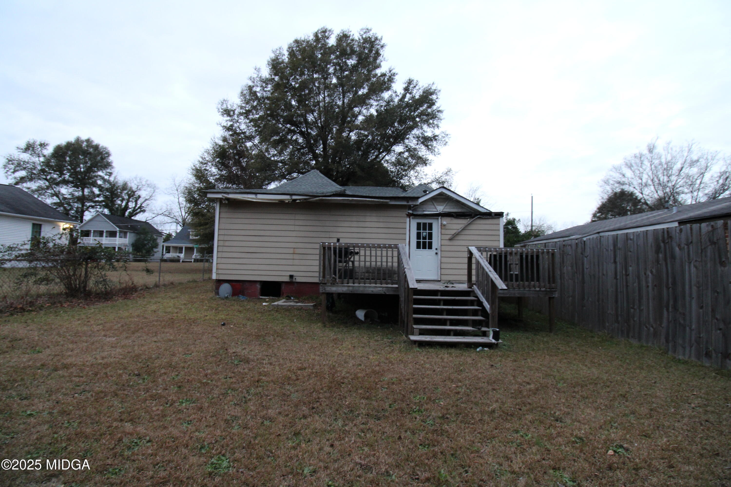 769 Bowman Street Macon, GA 31217 - Photo 11 of 12 a view of a wooden house with a yard