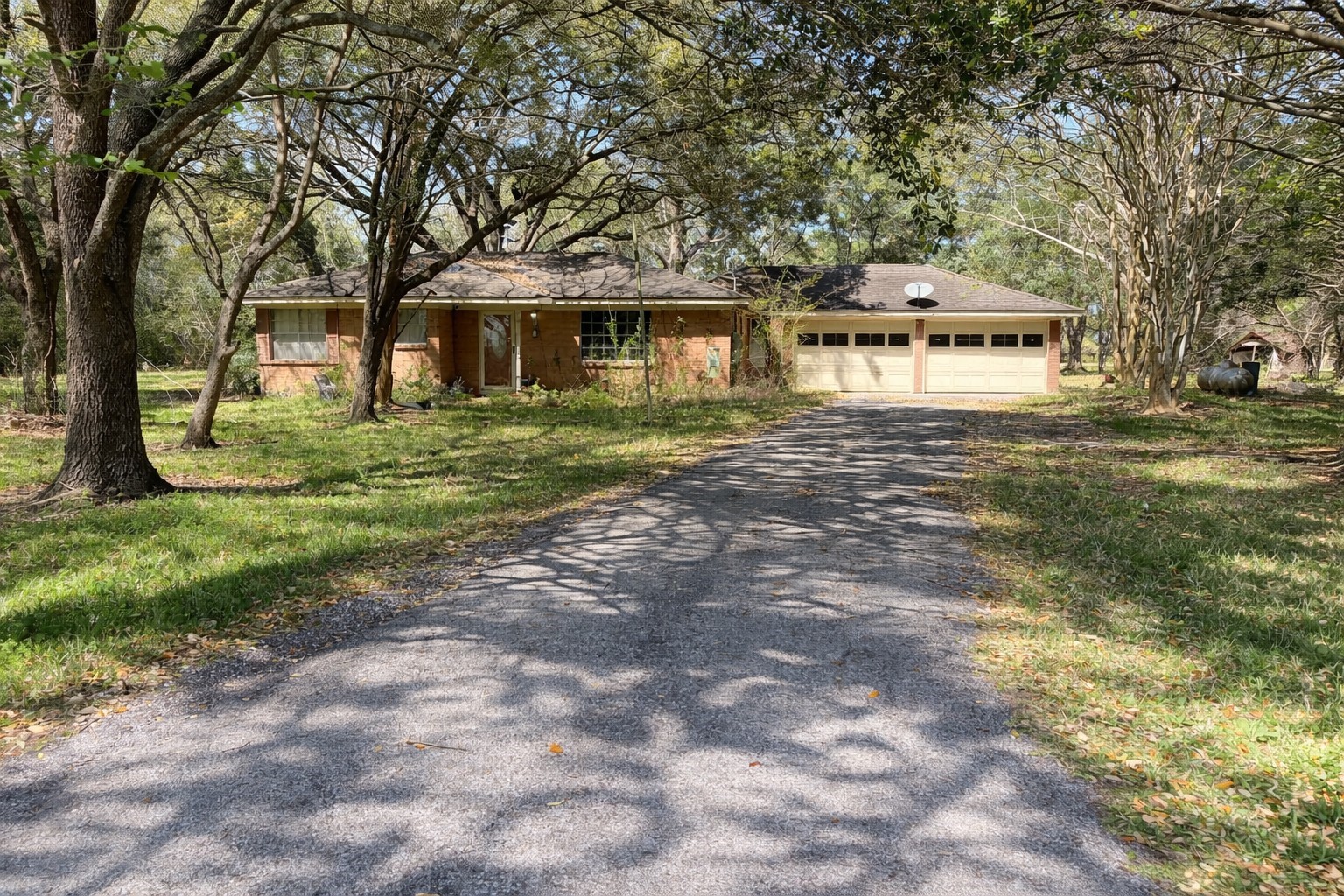 13502 30th Street Santa Fe, TX 77510 - Photo 3 of 16 a front view of a house with garden