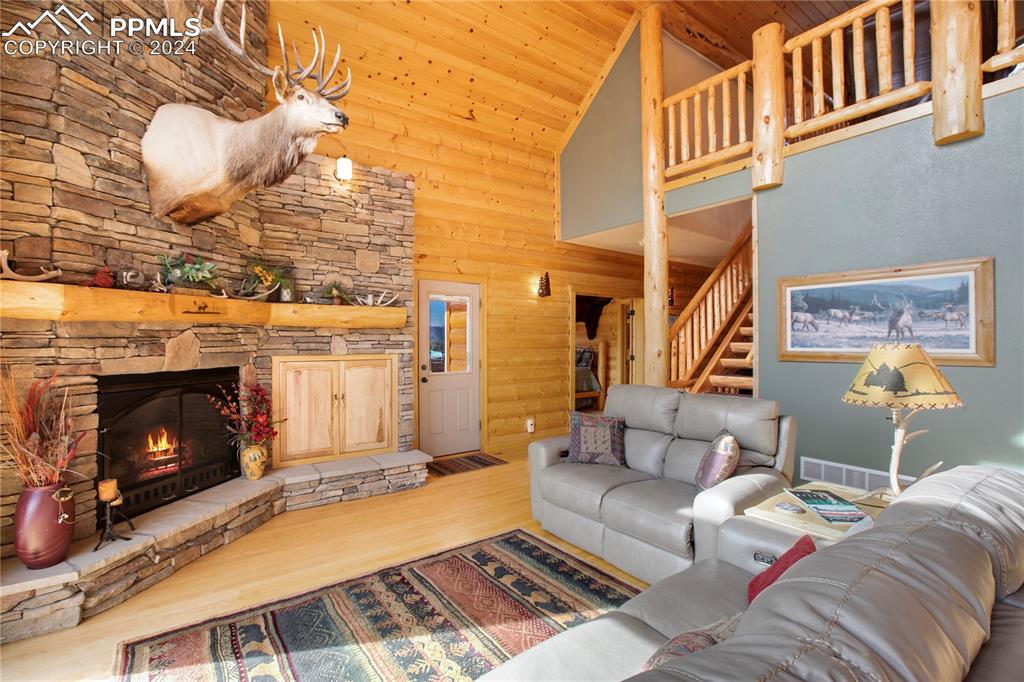 156 Paradiso Road Divide, CO 80814 - Photo 12 of 45 a living room with furniture and a fireplace