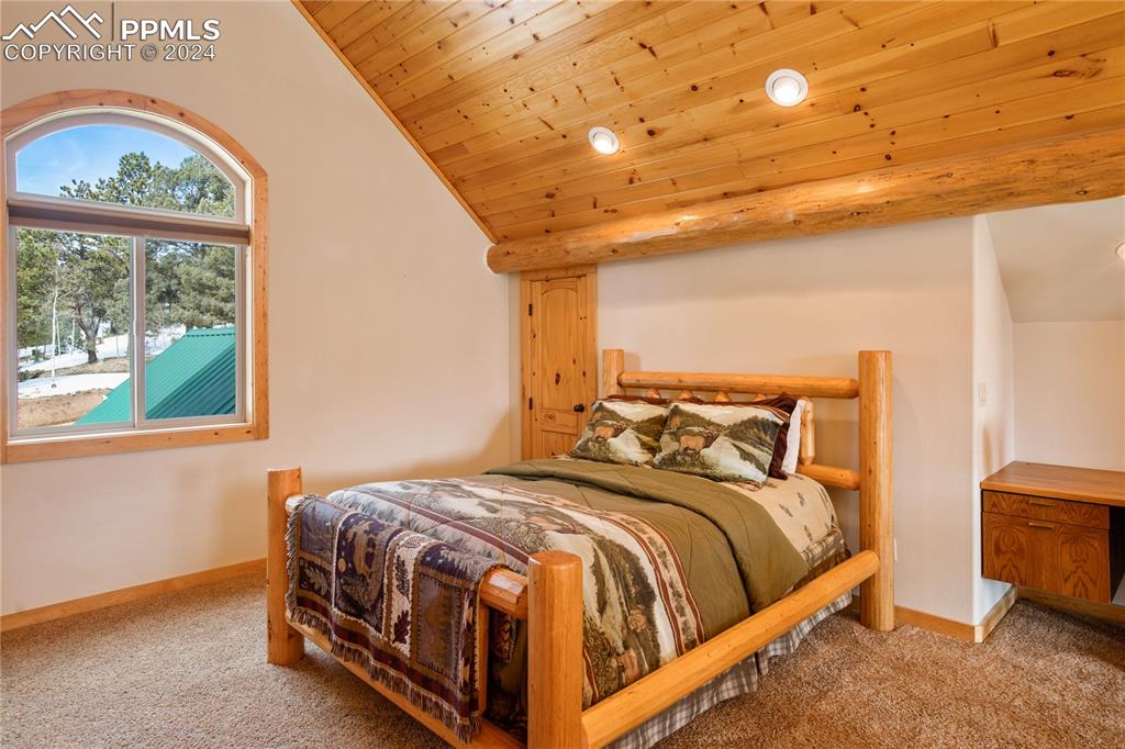 156 Paradiso Road Divide, CO 80814 - Photo 23 of 45 a bedroom with a bed and a window