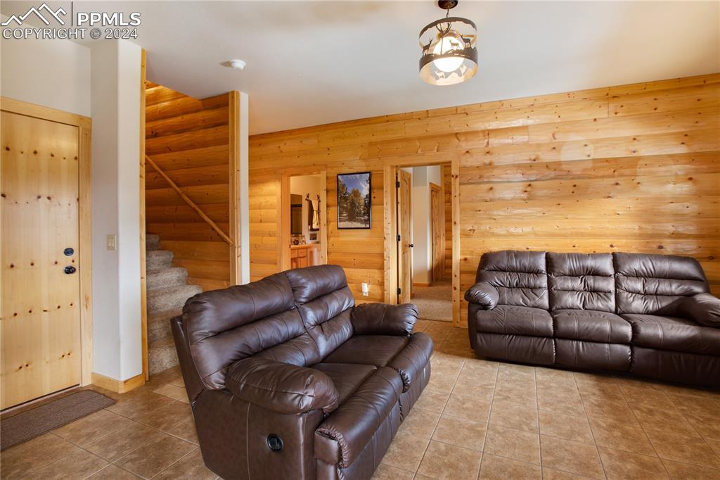 156 Paradiso Road Divide, CO 80814 - Photo 34 of 45 a living room with furniture a ceiling fan and a rug
