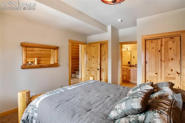 a bathroom with a double vanity sink toilet and mirror