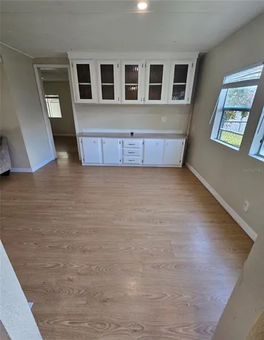 a kitchen with sink a counter top space and cabinets