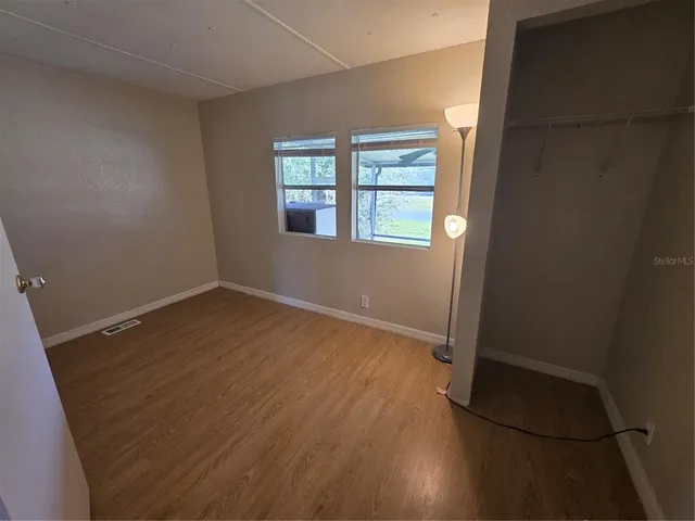 a view of a hallway view with staircase