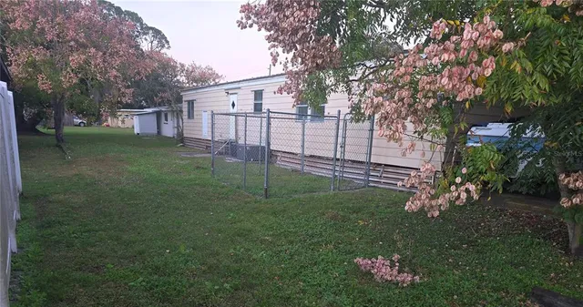 a backyard of a house with lots of green space