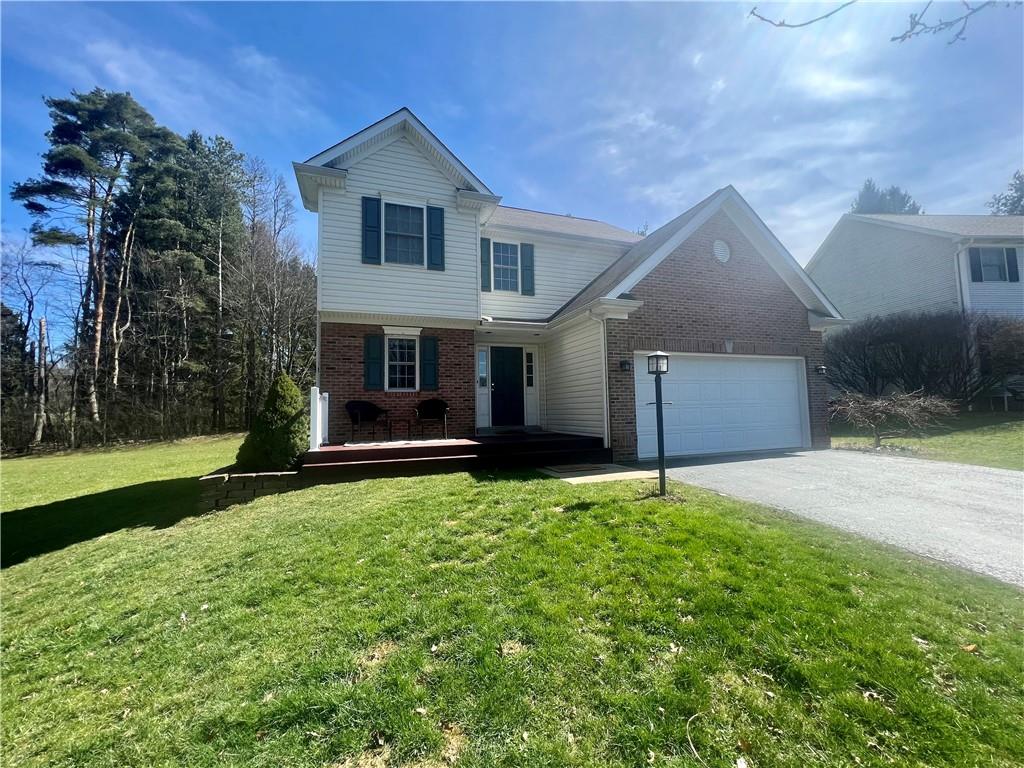 front view of a house with a yard