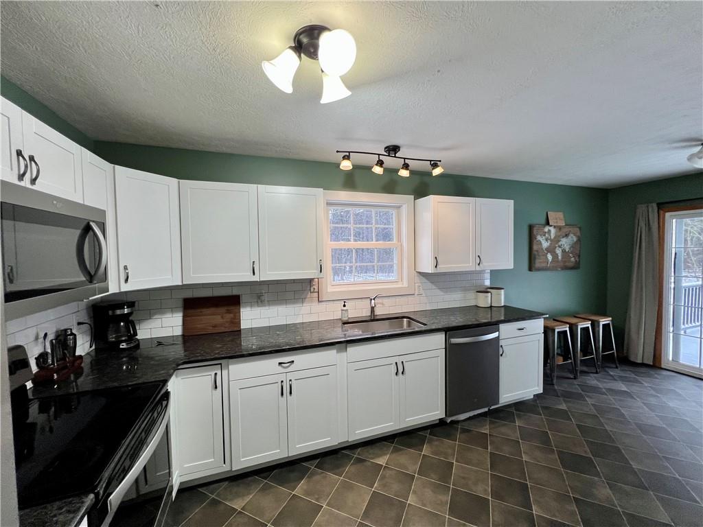 112 Old Forge Road Slippery Rock, PA 16057 - Photo 17 of 30 a kitchen with a sink cabinets and window