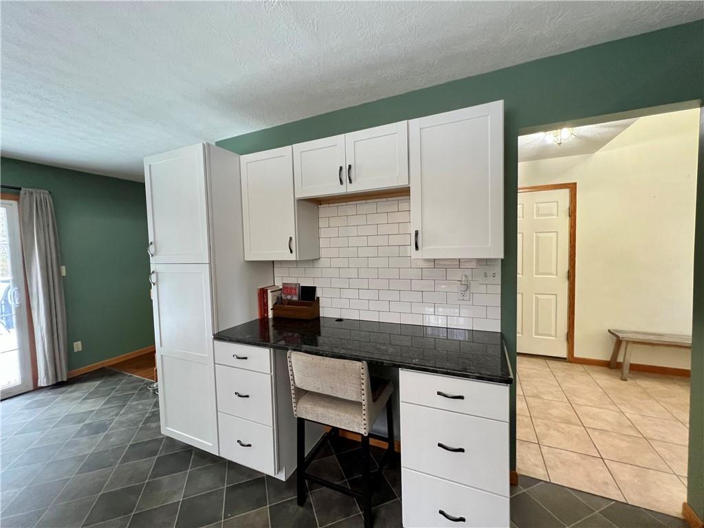 112 Old Forge Road Slippery Rock, PA 16057 - Photo 18 of 30 a kitchen with granite countertop white cabinets and sink