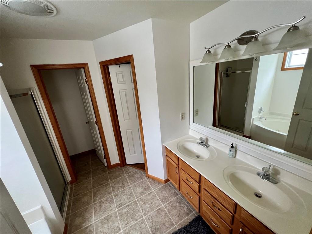 112 Old Forge Road Slippery Rock, PA 16057 - Photo 25 of 30 a bathroom with 2 sink and a mirror