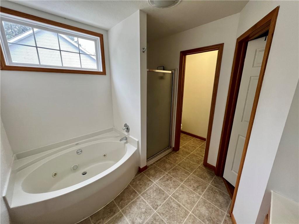 112 Old Forge Road Slippery Rock, PA 16057 - Photo 27 of 30 a bathroom with a bathtub and a shower