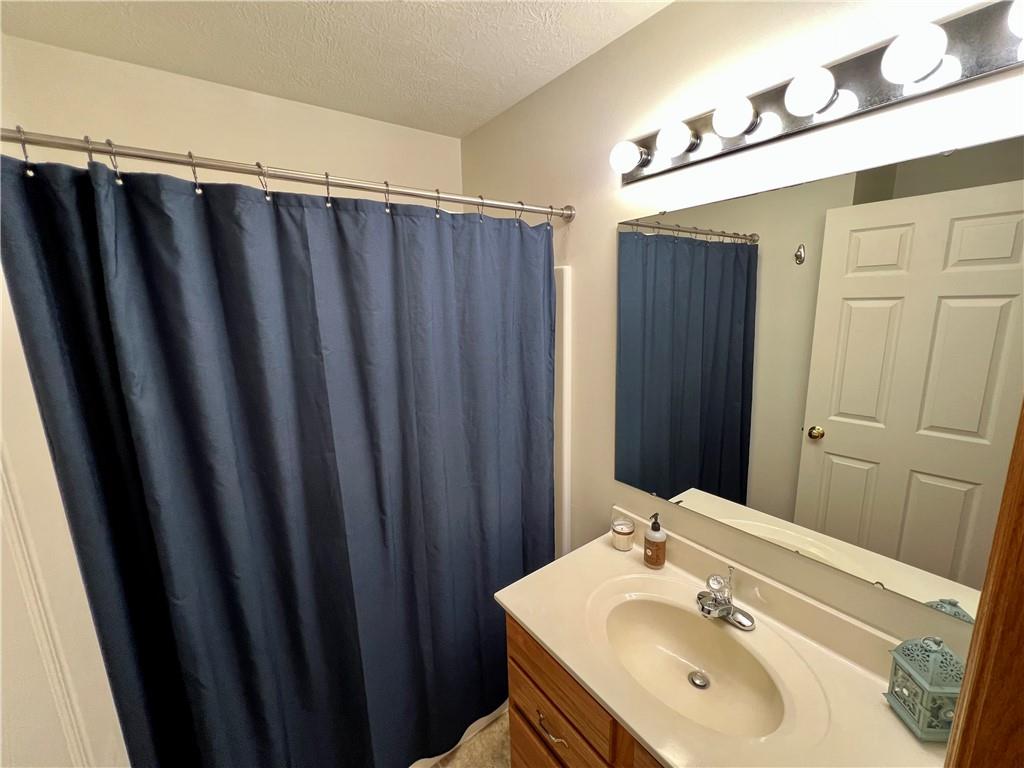 112 Old Forge Road Slippery Rock, PA 16057 - Photo 29 of 30 a bathroom with a sink and a mirror