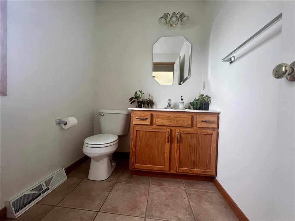 112 Old Forge Road Slippery Rock, PA 16057 - Photo 30 of 30 a bathroom with a toilet a sink and mirror