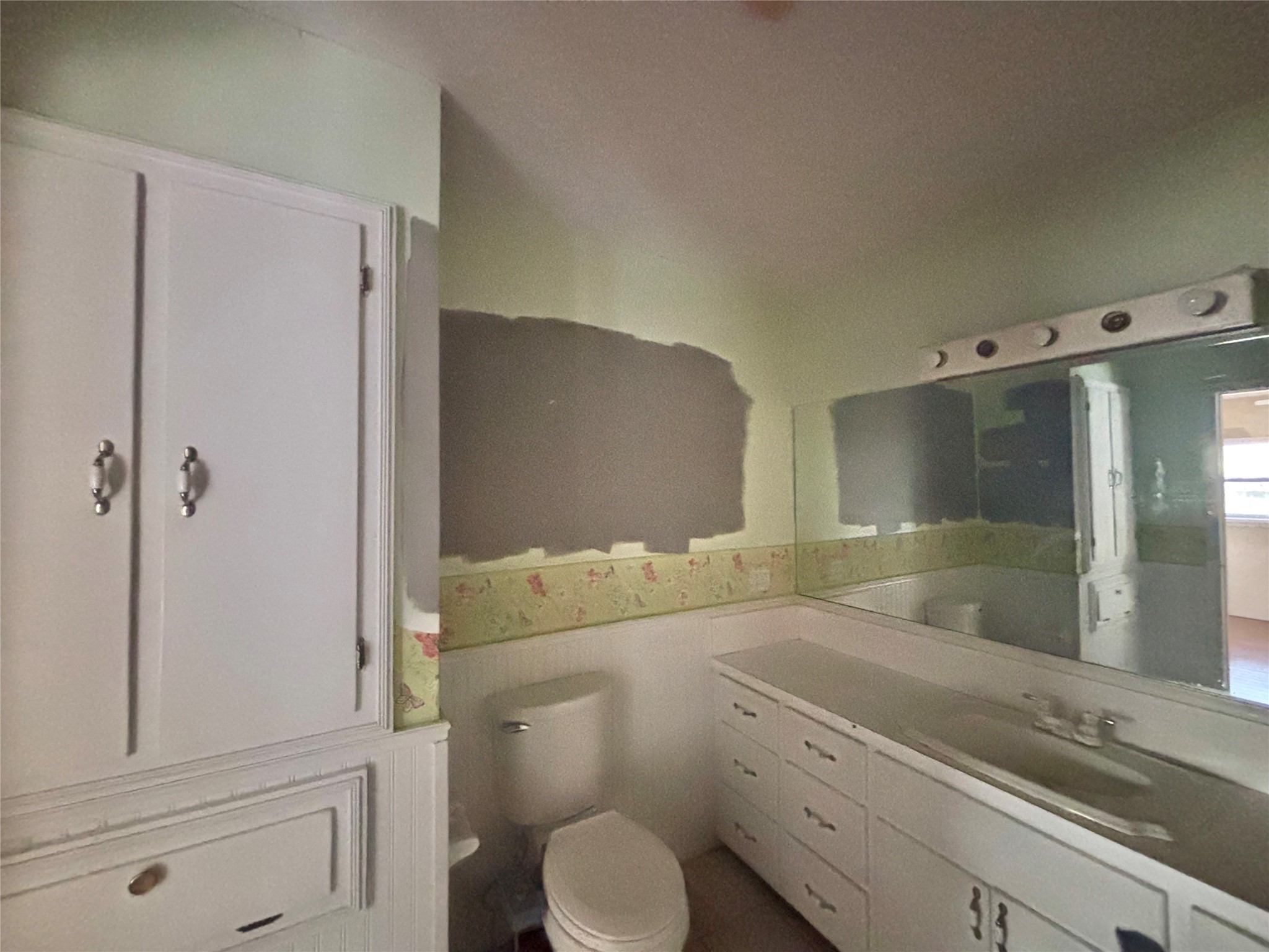 408 West Elder Street Colmesneil, TX 75938 - Photo 18 of 28 a bathroom with a granite countertop sink toilet and shower