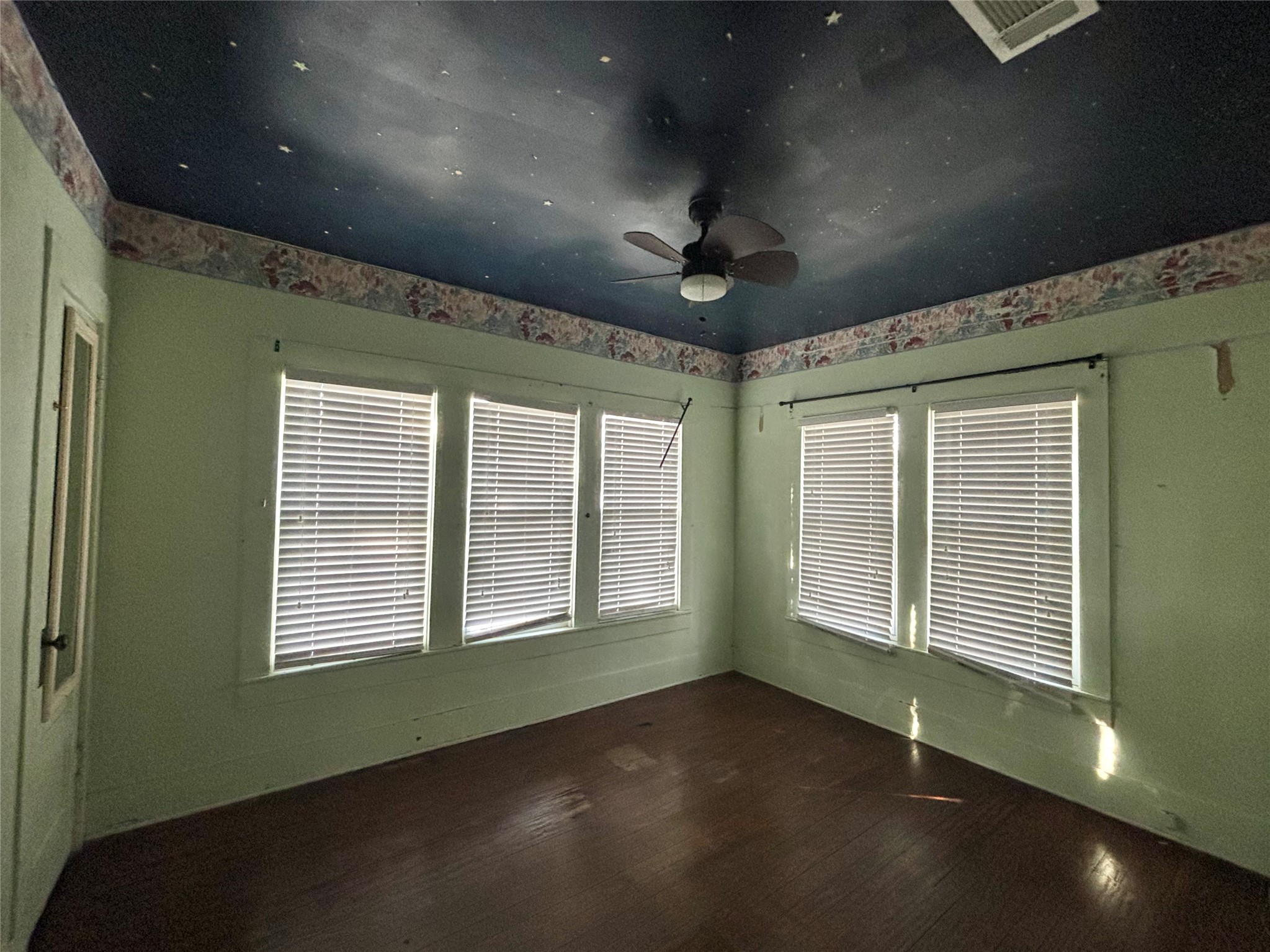 408 West Elder Street Colmesneil, TX 75938 - Photo 19 of 28 a view of an empty room with a window and chandelier