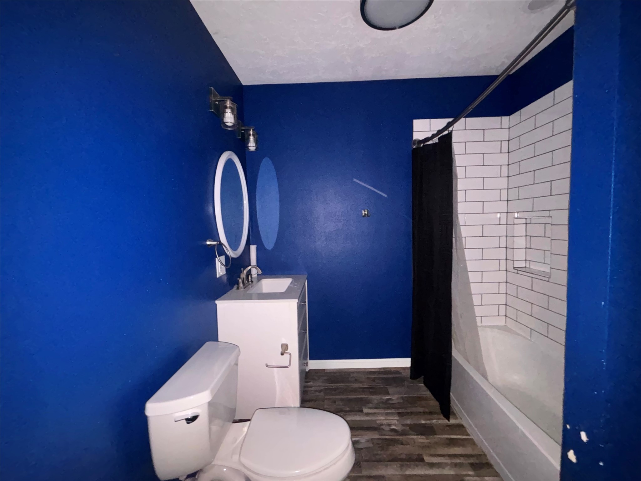 408 West Elder Street Colmesneil, TX 75938 - Photo 21 of 28 a bathroom with a toilet and a shower