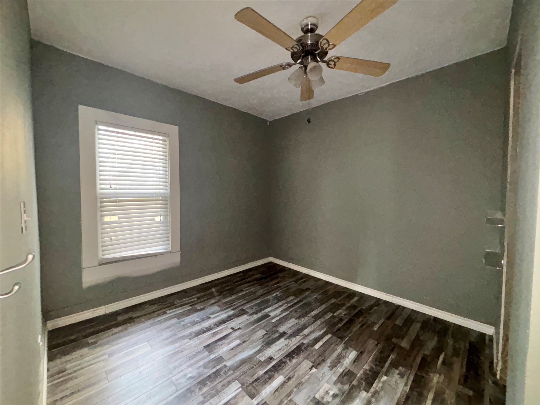 408 West Elder Street Colmesneil, TX 75938 - Photo 22 of 28 a view of a room that has a window in it