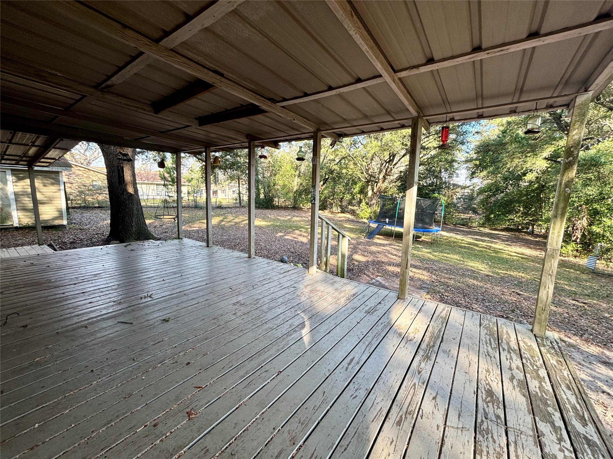 408 West Elder Street Colmesneil, TX 75938 - Photo 25 of 28 a view of a patio with wooden floor