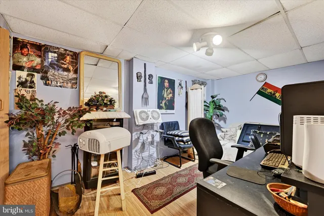 a dining room with furniture and wooden floor