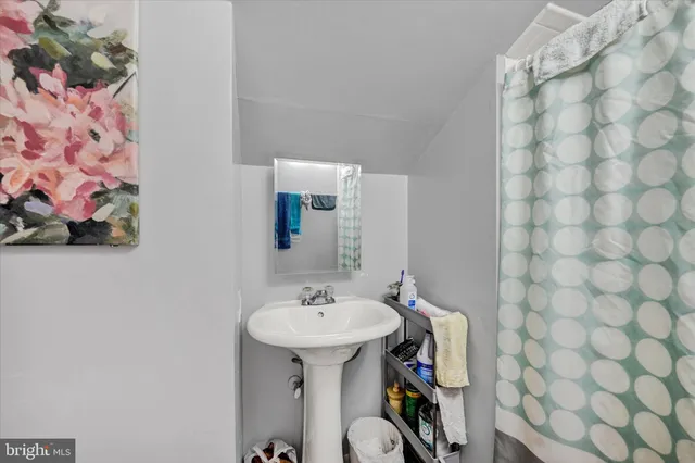 a bathroom with a sink and mirror