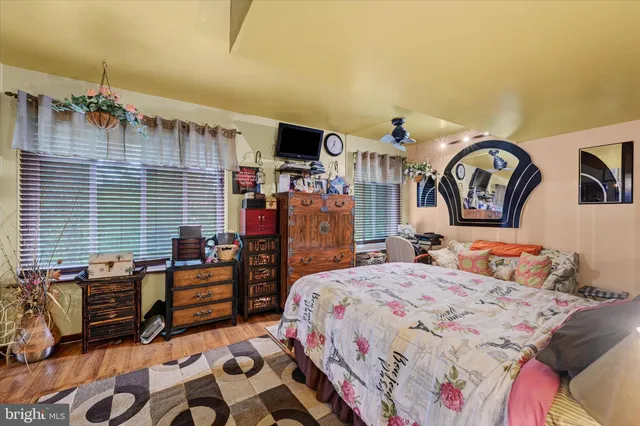 a bedroom with bed and window