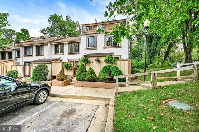 a view of a car parked in front of a house