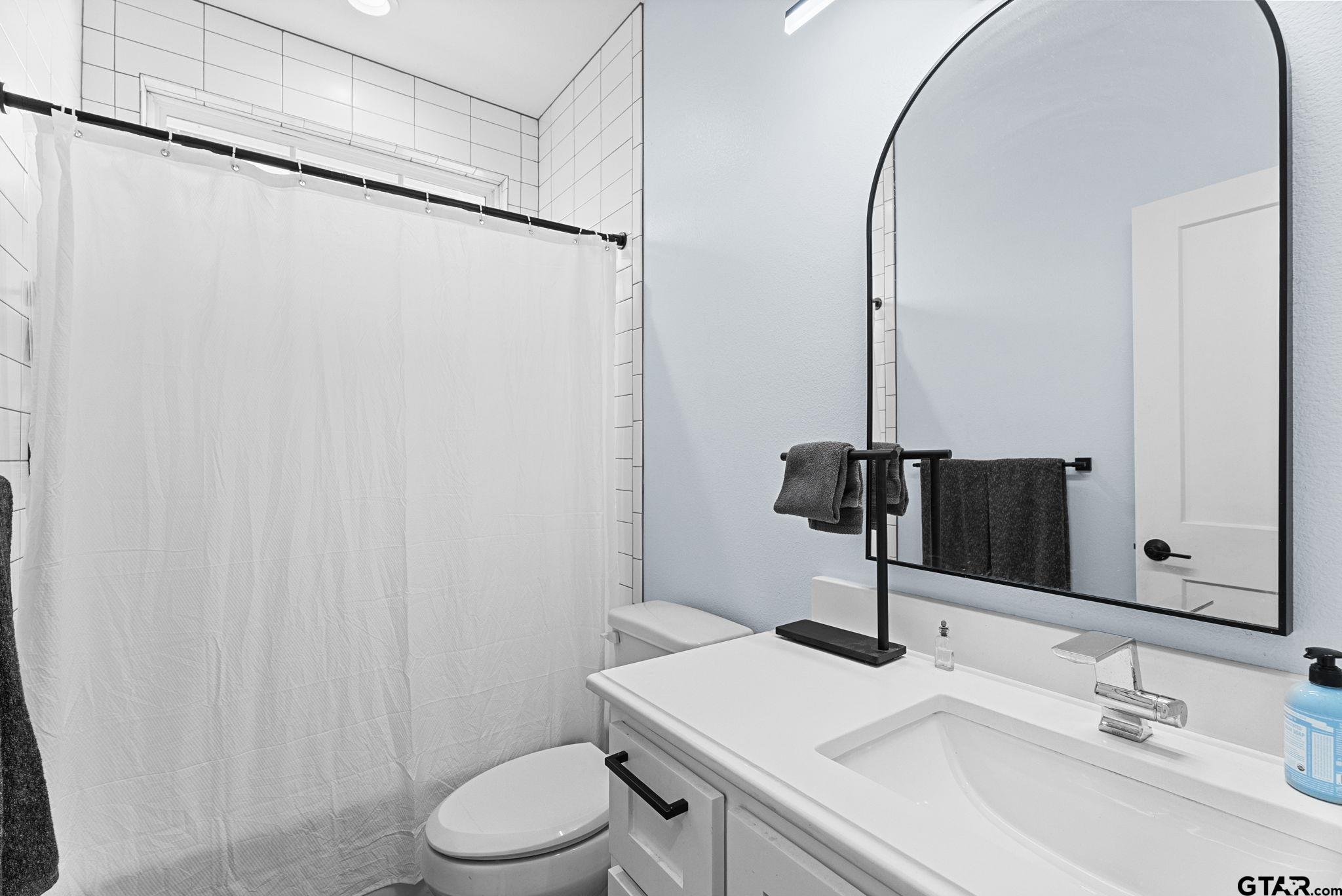 10374 Highway 204 Cushing, TX 75760 - Photo 20 of 28 a bathroom with a sink and a mirror