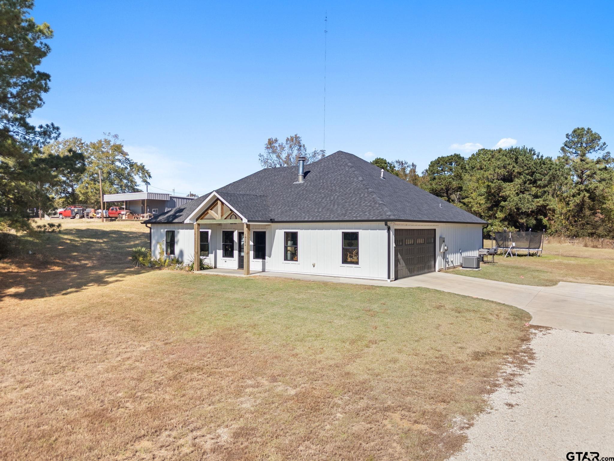10374 Highway 204 Cushing, TX 75760 - Photo 2 of 28 front view of a house with a yard