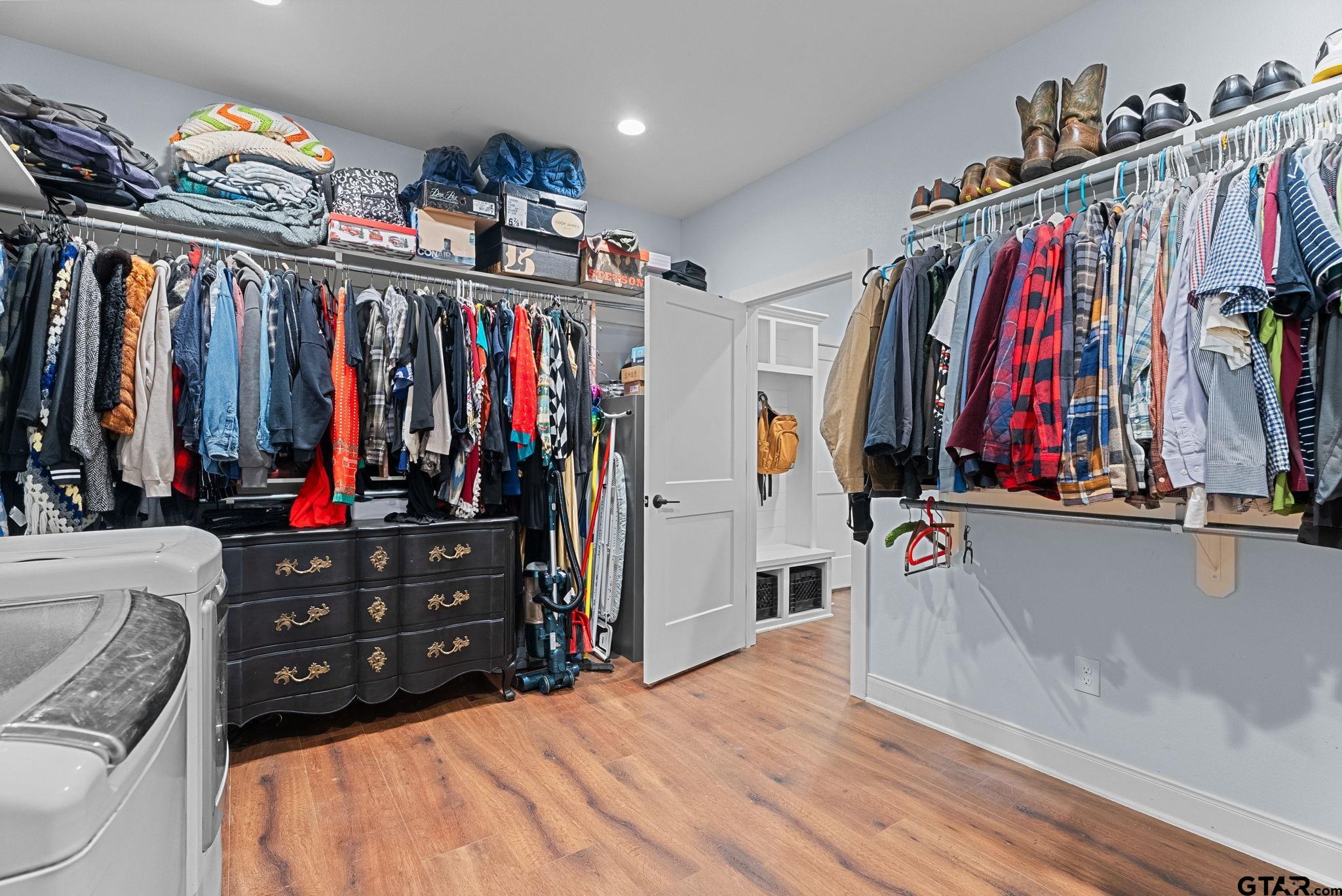 10374 Highway 204 Cushing, TX 75760 - Photo 23 of 28 a view of walk in closet with clothes and shoes