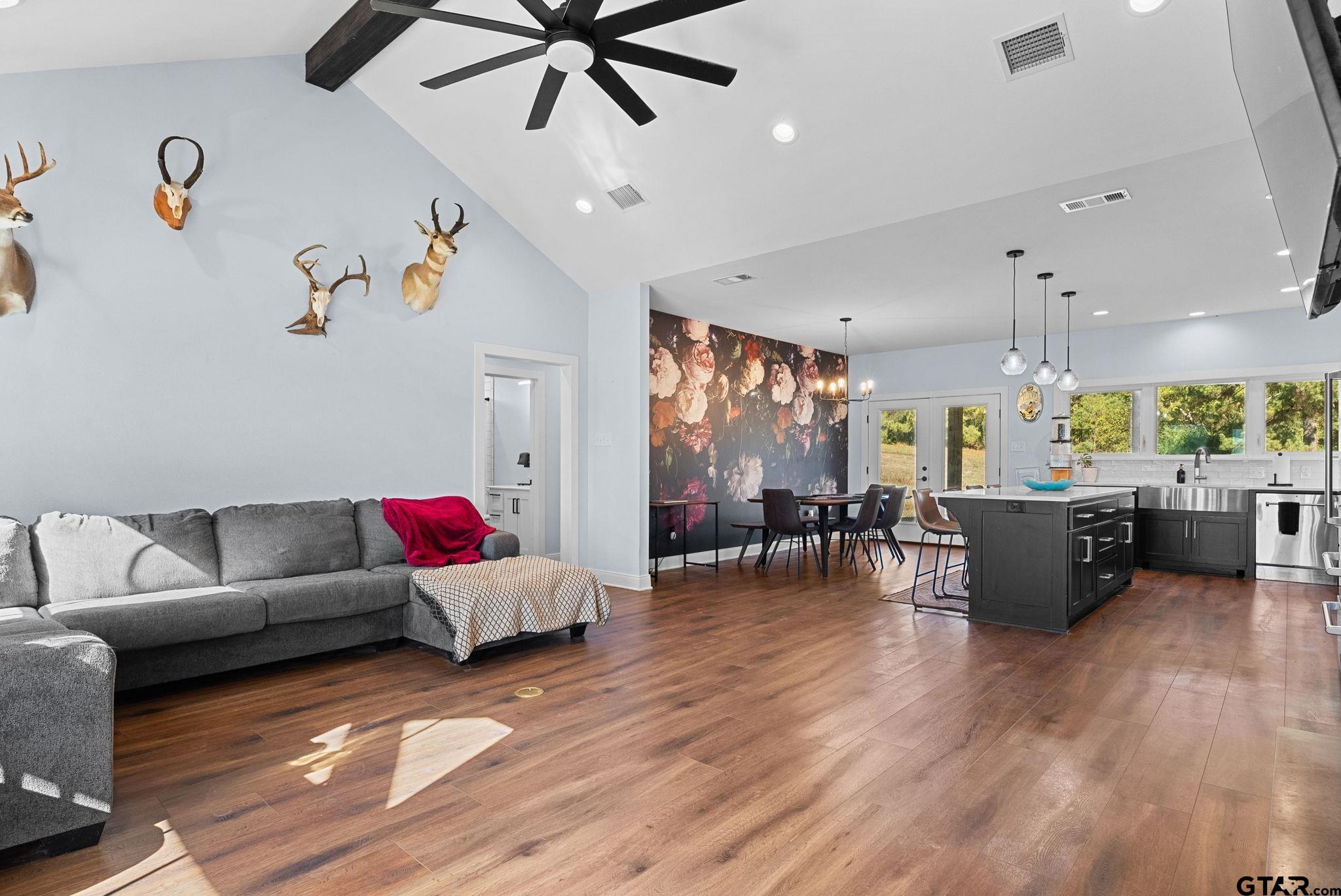 10374 Highway 204 Cushing, TX 75760 - Photo 3 of 28 a living room with furniture and a wooden floor