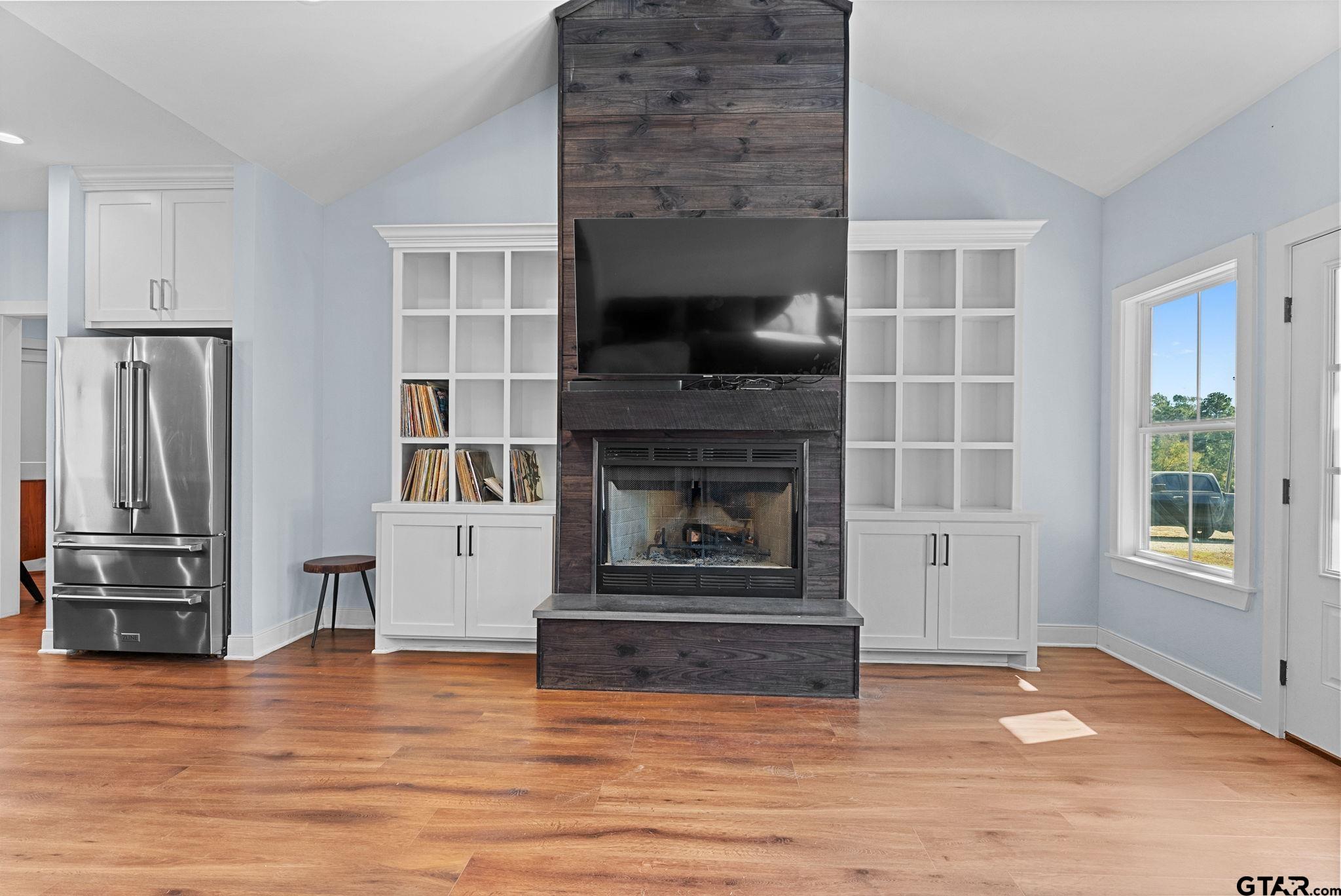 10374 Highway 204 Cushing, TX 75760 - Photo 5 of 28 a living room with furniture and a fireplace
